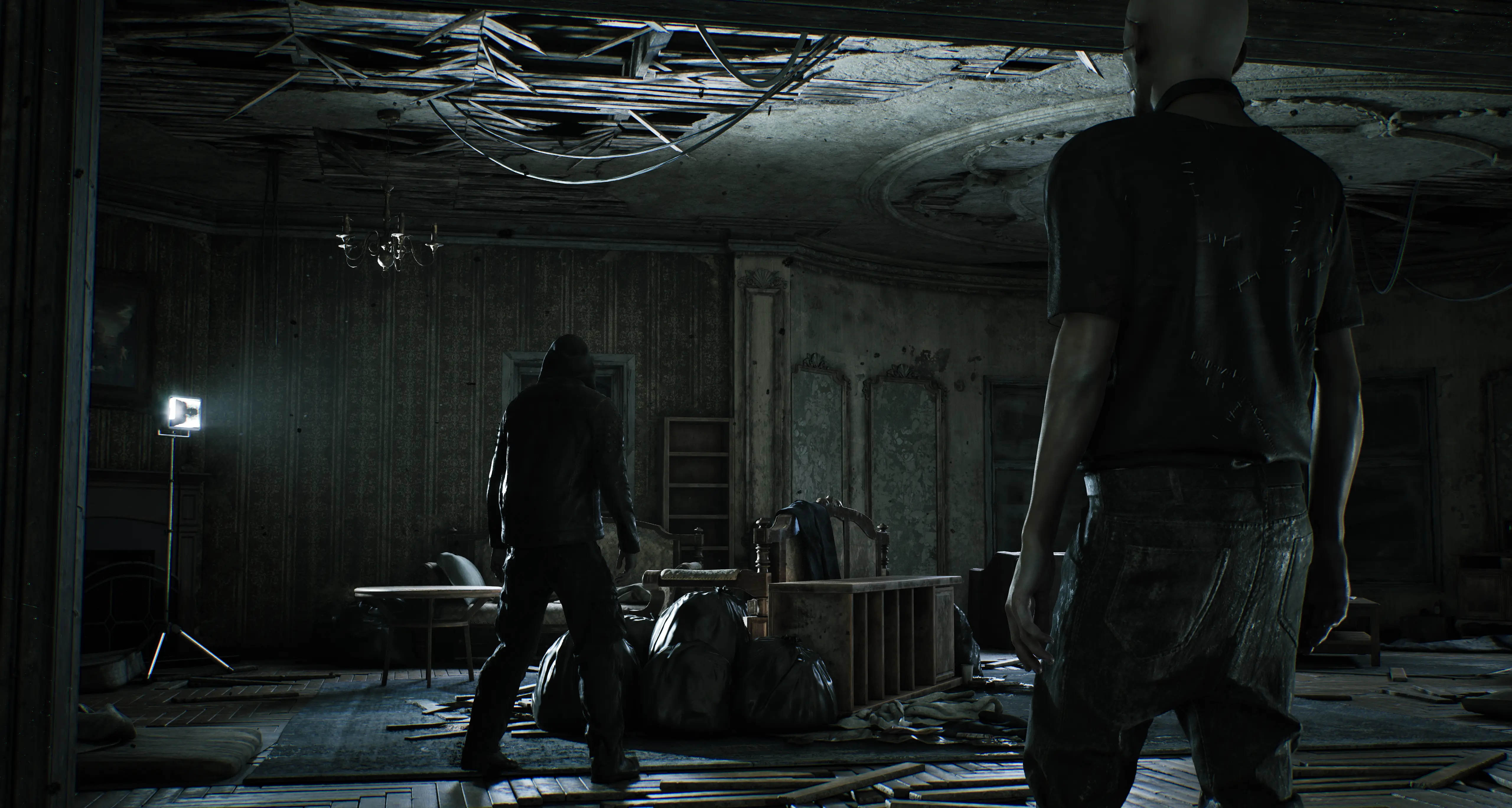 An image of two suspicious looking people searching through the abandoned mansion in Hunter: The Reckoning - Deathwish game by TEYON